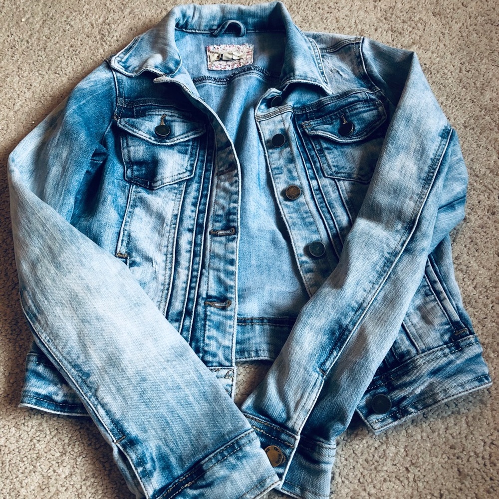 Light wash distressed denim jacket